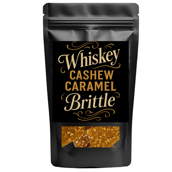 Black packaging of Whiskey Cashew Caramel Brittle with gold text on a white background